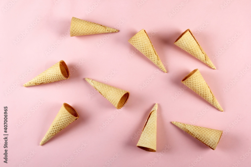 Emty Ice cream cones pattern on pink background. Top view. Several wafer ice cream cones designe Emty Ice cream cones pattern on pink background. Top view. Several wafer ice cream cones designe