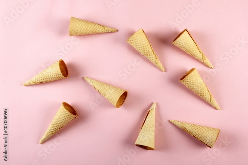 Emty Ice cream cones pattern on pink background. Top view. Several wafer ice cream cones designe