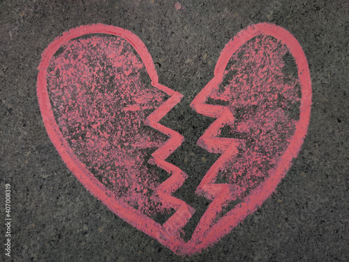 Hand drawn heart breaking symbol. Love break up symbol. Using color chalk pieces.