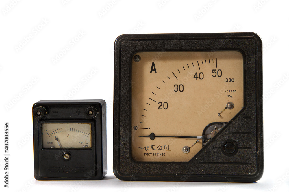 Two old ammeters from the 60s of the 20th century. Ammeters for 2 and 50 amperes on a white background. Two old ammeters from the 60s of the 20th century. Ammeters for 2 and 50 amperes on a white background.