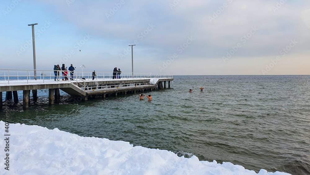 Winter swimming. People winter bathing in the sea.