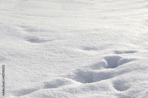 Background with white snow. Snow drifts, hills and mountains.