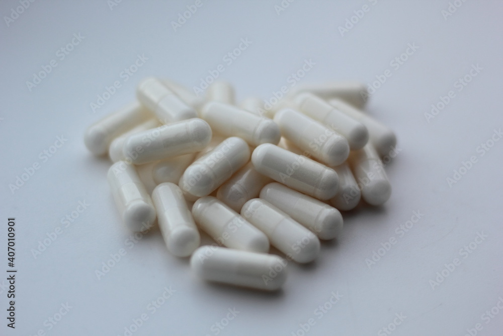 Closeup of myo-inositol capsules. Myo-inositol is a commonly used supplement for treating PCOS symptoms.