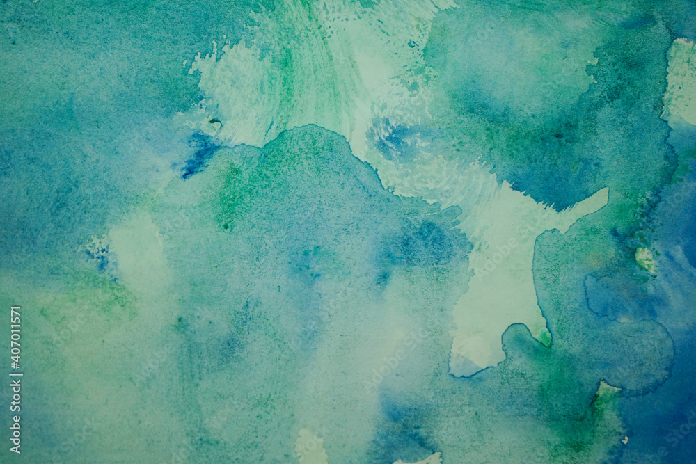 Blue green watercolor background. Abstract turquoise background with copy space for your design. Aquarelle paint paper textured canvas.