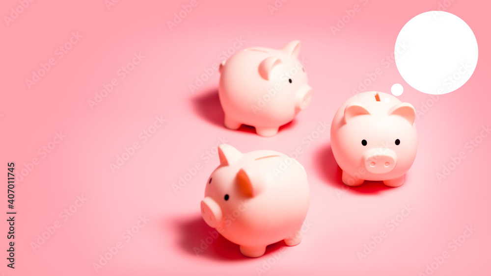 Piggy banks with white blank bubble text on isolated pink background with copy space. Money Saving Concepts Piggy banks with white blank bubble text on isolated pink background with copy space. Money Saving Concepts