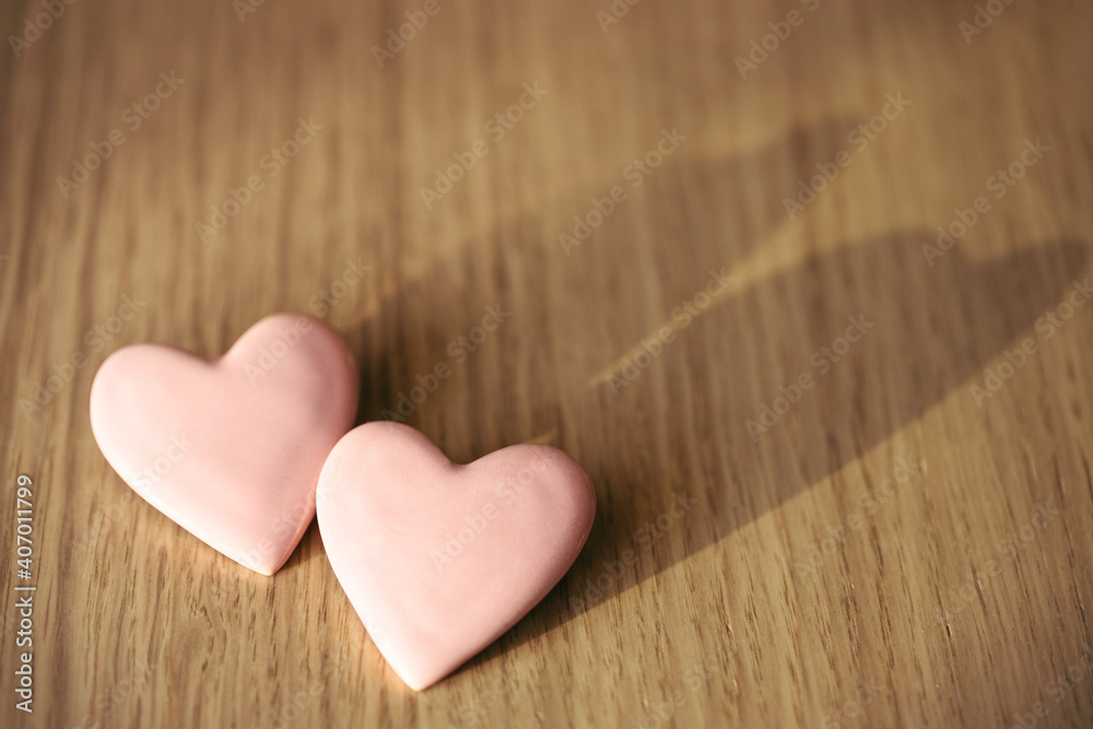 Two pink hearts on wooden table. Valentine's card. Two pink hearts on wooden table. Valentine's card.
