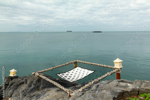 net seat with sea space and boat