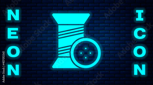 Glowing neon Sewing thread on spool and button icon isolated on brick wall background. Yarn spool. Thread bobbin. Vector Illustration.