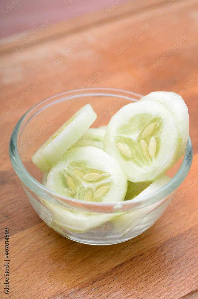 sliced cucumber on a glass bowl sliced cucumber on a glass bowl