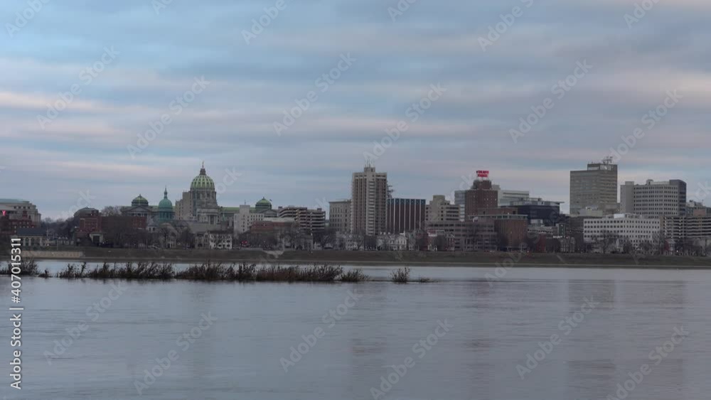 Harrisburg, Pennsylvania - January 7, 2021: A view of the Harrisburg state capital across the Susquehanna River. Harrisburg, Pennsylvania - January 7, 2021: A view of the Harrisburg state capital across the Susquehanna River.