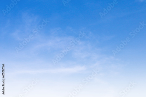 Bright blue sky with white cloud daytime background.