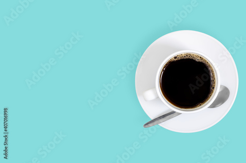 White cups with coffee on a bright colored background.