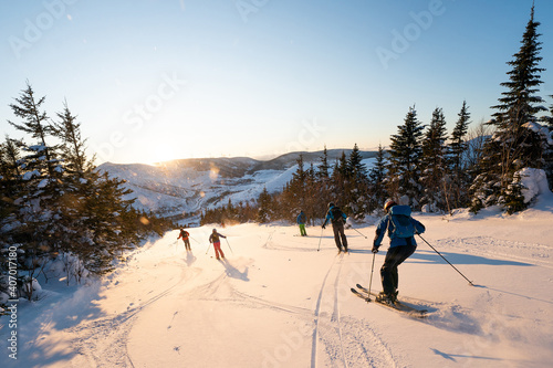 Group of friends skiing in the Chic Chocs in Quebec Canada © Colin