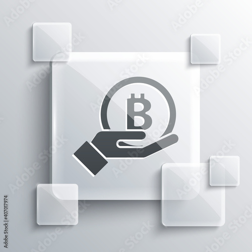 Grey Hand holding Bitcoin icon isolated on grey background. Blockchain technology, digital money market, cryptocoin wallet. Square glass panels. Vector.