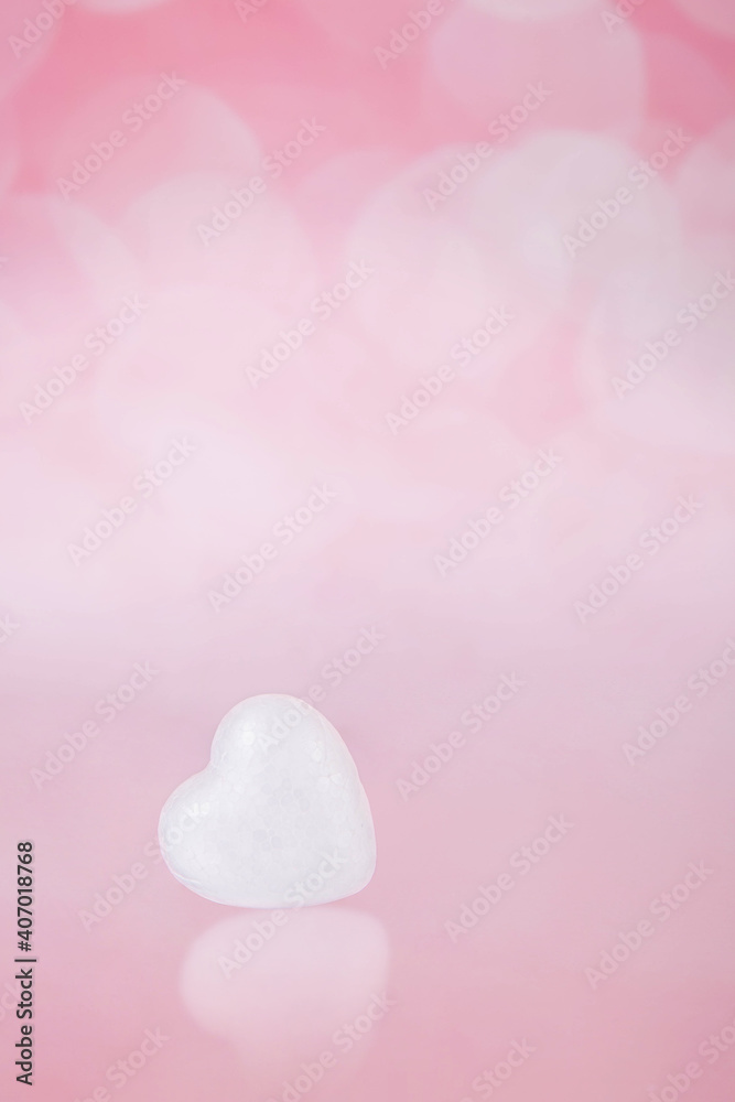 One little white heart on a pink with bohe background One little white heart on a pink with bohe background