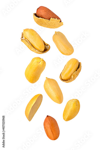 Isolated nuts. Nine flying peanuts witout shell on white with clipping path as package design element. Full depth of field. Food levitation concept. photo