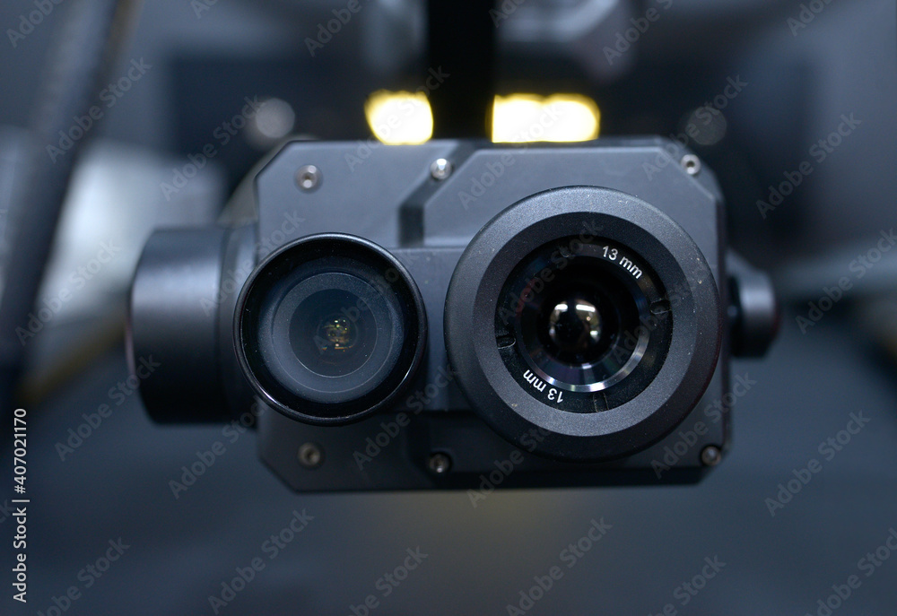 Dual lens camera designed for industrial drones, placed on a stand