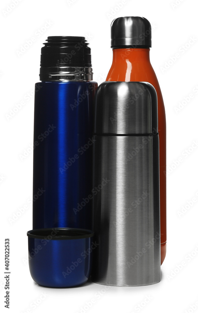 Different stylish thermo bottles isolated on white Different stylish thermo bottles isolated on white