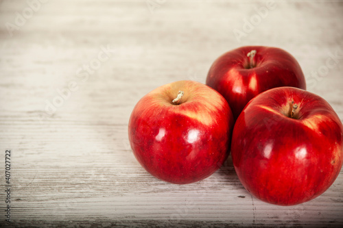 red apples on the table on a light background