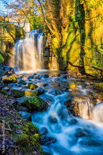 A long exposure panorama view of an upper waterfall section at Lumsdale on Bentley Brook  Derbyshire  UK
