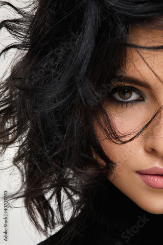 Εκτύπωση καμβά portrait of gorgeous beautiful curly brunette woman on studio background