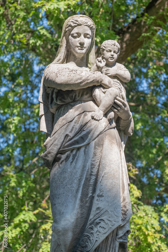 Ancient statue of the Virgin Mary with Jesus Christ. Vertical image. © zwiebackesser