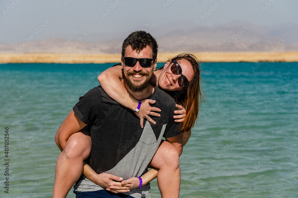 Happy couple posing at lake in desert of Ras Mohammed National Park. Egypt
