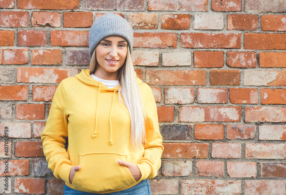 Portrait of beautiful young woman with smile face looking at camera. Outdoors daylight. Cute girl wearing casual clothing. Portrait of beautiful young woman with smile face looking at camera. Outdoors daylight. Cute girl wearing casual clothing.