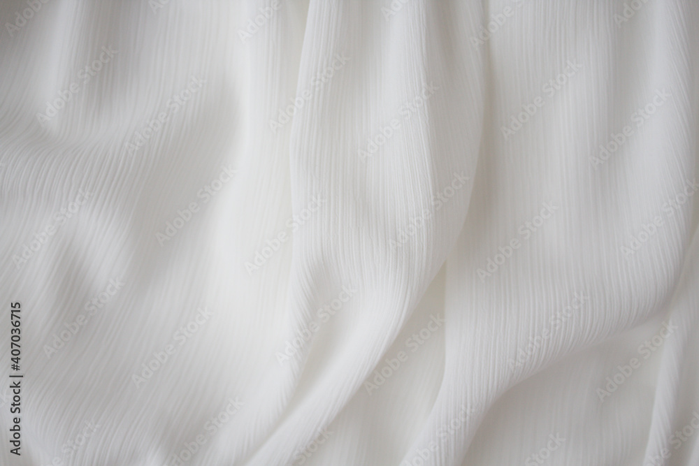 The texture of a luxurious white chiffon fabric for a celebration