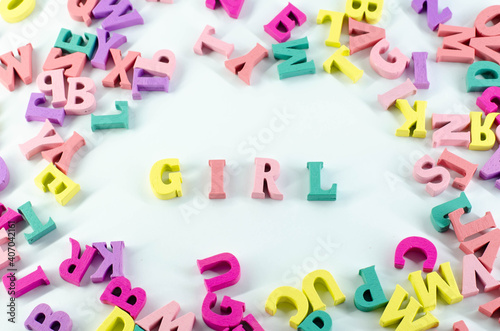 Letters on a white surface. The word  girl . Word from letters. Isolated image.