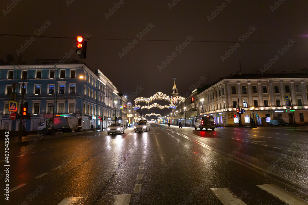 Illumination and car traffic on the Nevsky prospect in the late evening.