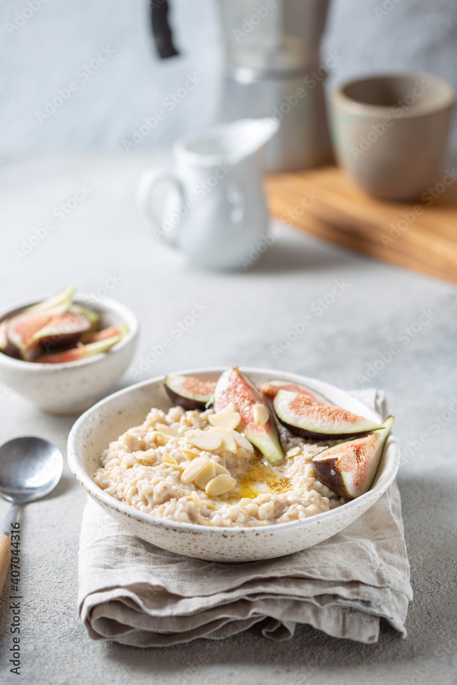 Healthy Oatmeal with figs. Coffee, oatmeal breakfast concept
