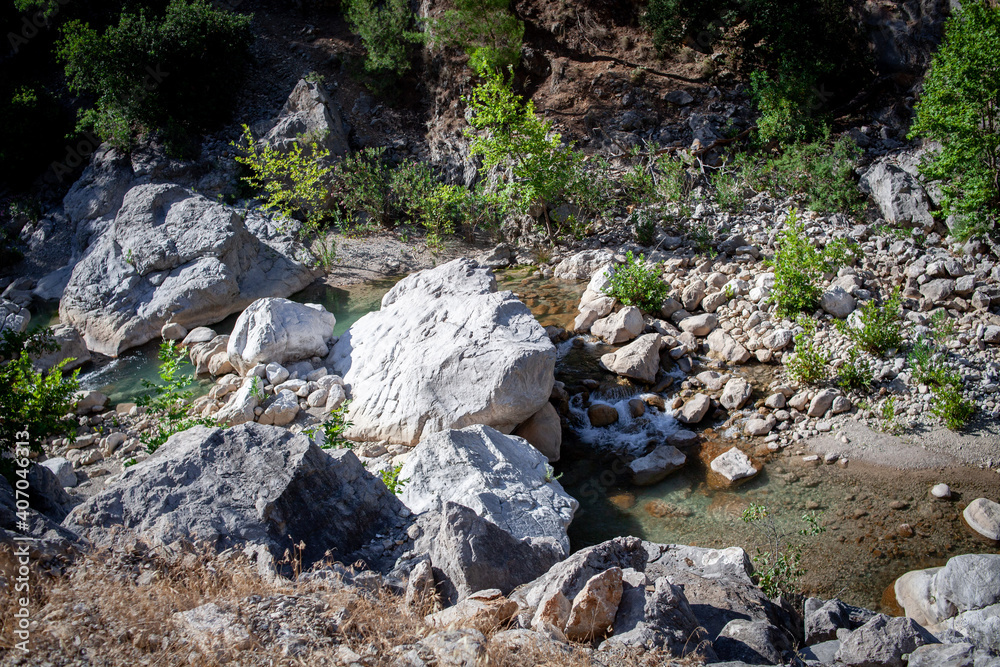 View of a mountain creek river in the rocks in Goynuk canyon in Antalya province, Turkey. View from above. View of a mountain creek river in the rocks in Goynuk canyon in Antalya province, Turkey. View from above.