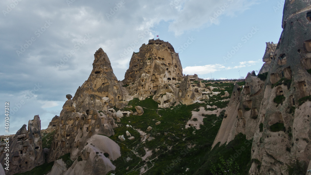 Uchisar castle mountain with surrounding landscape and magnificent stone structures near Goreme at Cappadocia, Anatolia, Turkey