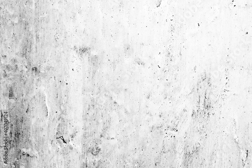Texture of a concrete wall with cracks and scratches which can be used as a background © chernikovatv
