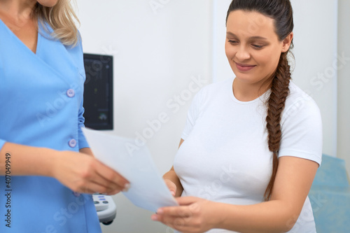 Pregnant woman getting medical consultation at hospital