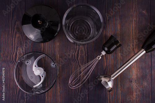 blender and whisk on a wooden table