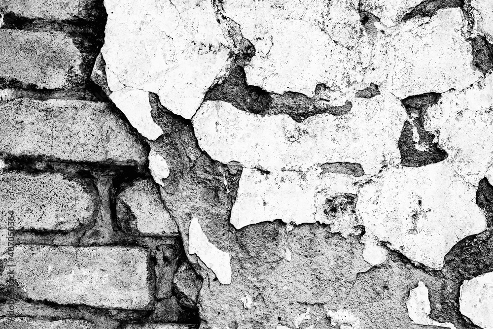 Obraz premium Texture of a brick wall with cracks and scratches which can be used as a background