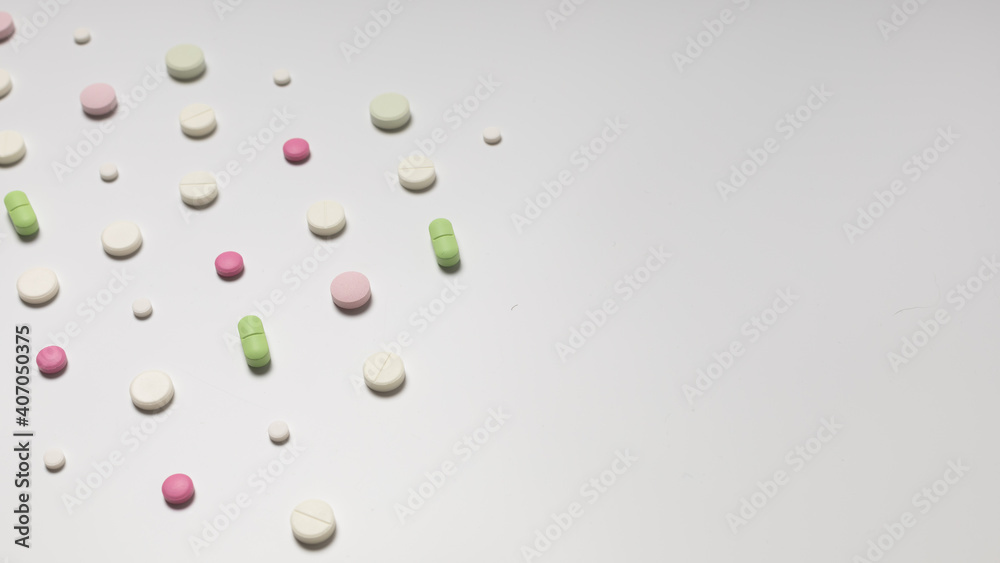 Multicolored pills on white background, pattern Multicolored pills on white background, pattern