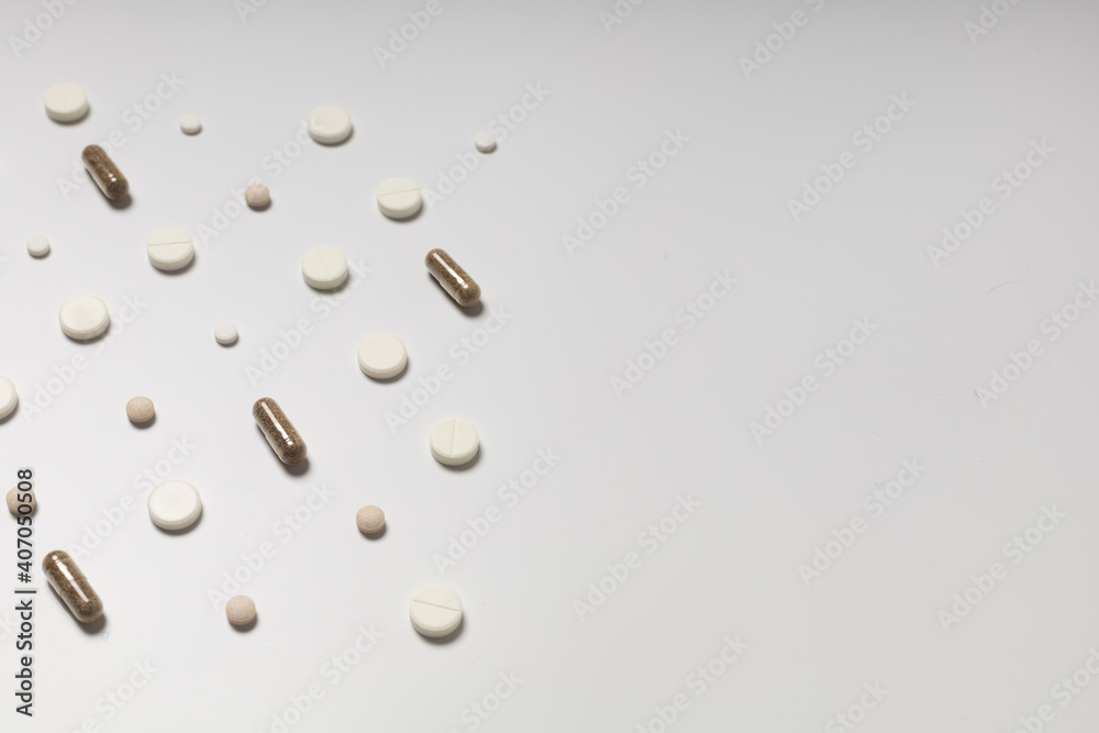 Multicolored pills on white background, pattern Multicolored pills on white background, pattern