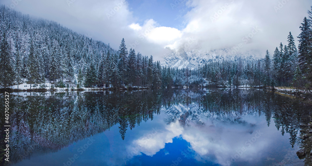 Fototapeta premium Amazing winter landscape with snowy mountains and clear waters of Green lake (Gruner see), famous tourist destination in Styria region, Austria