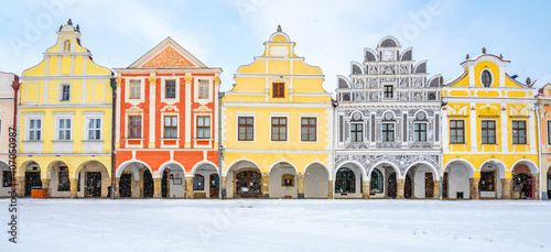 Main square of Telc with its famous 16th-century colorful houses, a UNESCO World Heritage Site since 1992, on a winter day with falling snow. photo