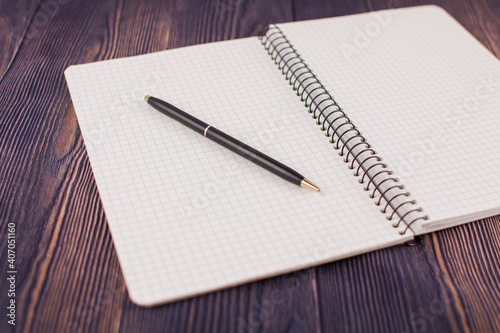 Wallpaper Mural notebook with pen on a wooden table Torontodigital.ca