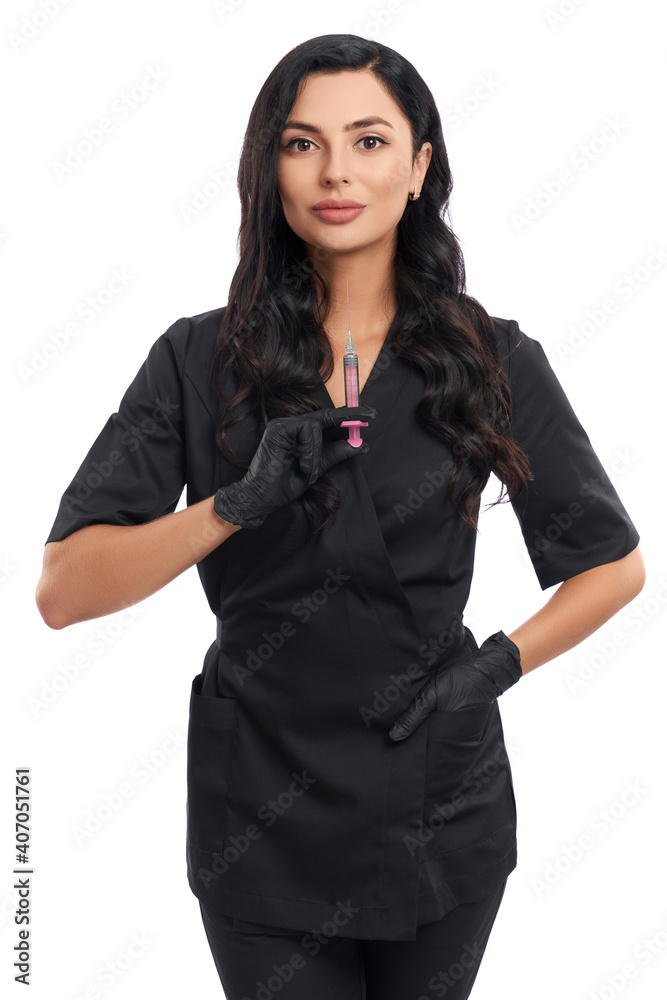 Beautician posing over white background with syringe in hand Beautician posing over white background with syringe in hand