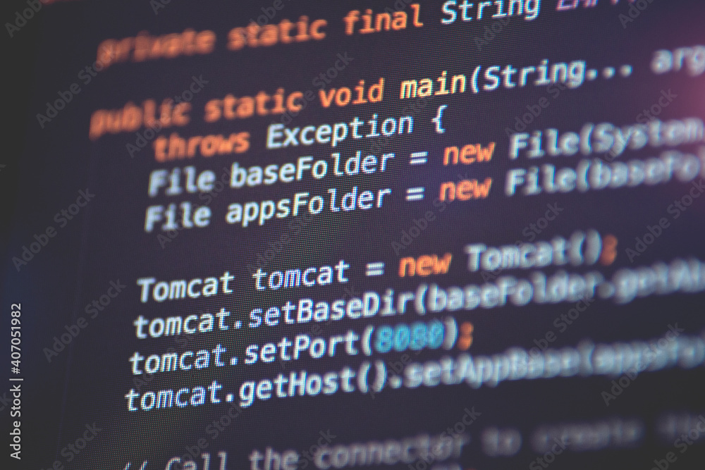 Software developer programming code. Abstract computer script code closeup on monitor screen with bokeh. Software developer programming code. Abstract computer script code closeup on monitor screen with bokeh.