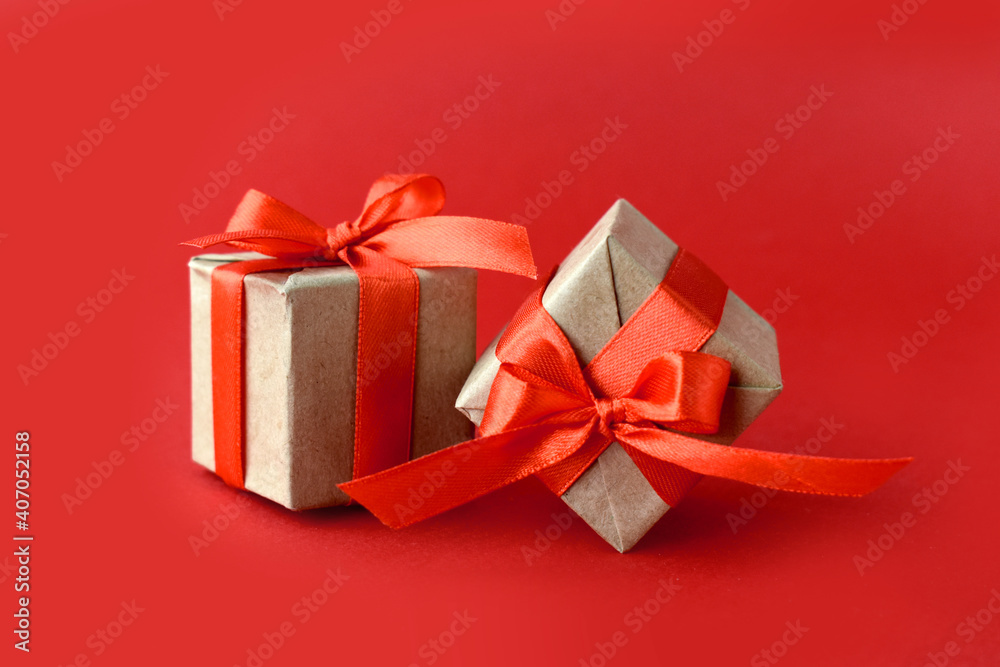Close up gifts on red background. Minimalist concept for Valentines day,  Mothers day, Women day or wedding. Greeting card.