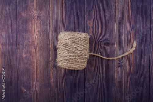 dark craft thread on a wooden background