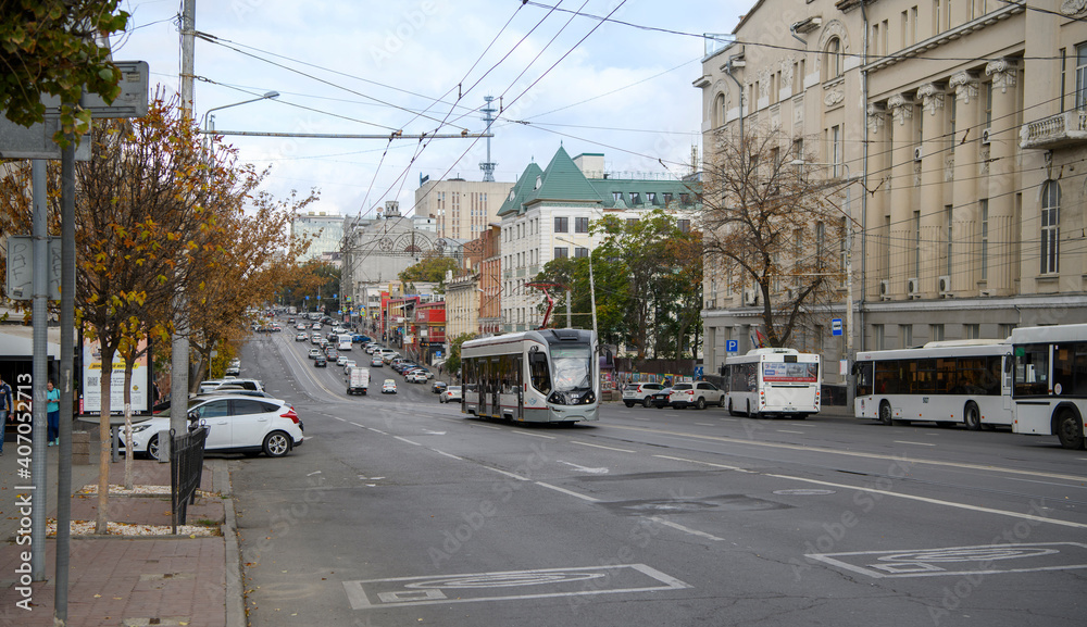   Autumn has come to the city.Pedestrians and auto move along Budenovsky Avenue