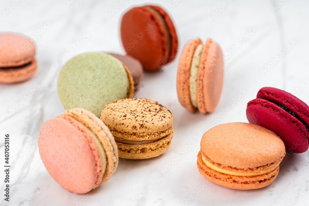Colorful Fruity Macarons Flat Lay and Top View on White Marble Table Colorful Fruity Macarons Flat Lay and Top View on White Marble Table