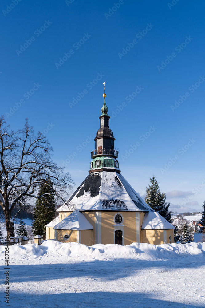 Church in Christmas Village Seiffen Ore Mountains in Saxony Germany at wintertime.